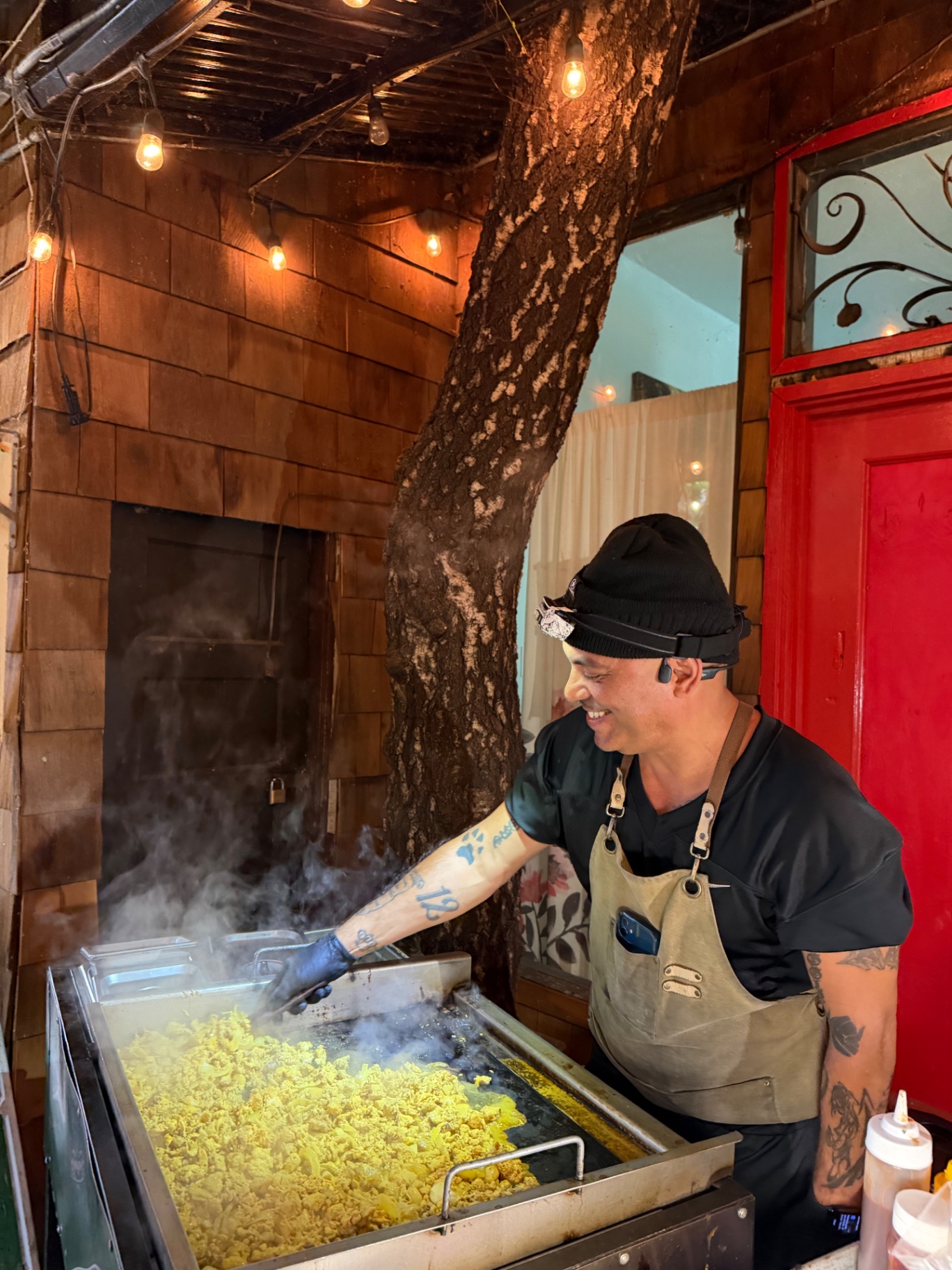 Lex cooking at the griddle during an event